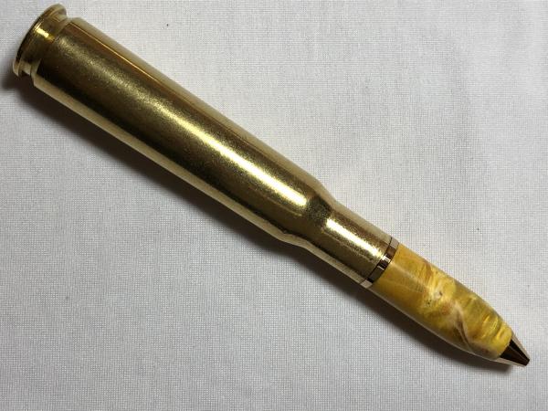 50 caliber machine gun bullet pen made with various woods, gold hardware, and a genuine casing