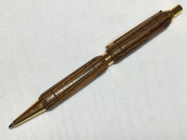 Slimline pencils from various woods, gold hardware with black accent.