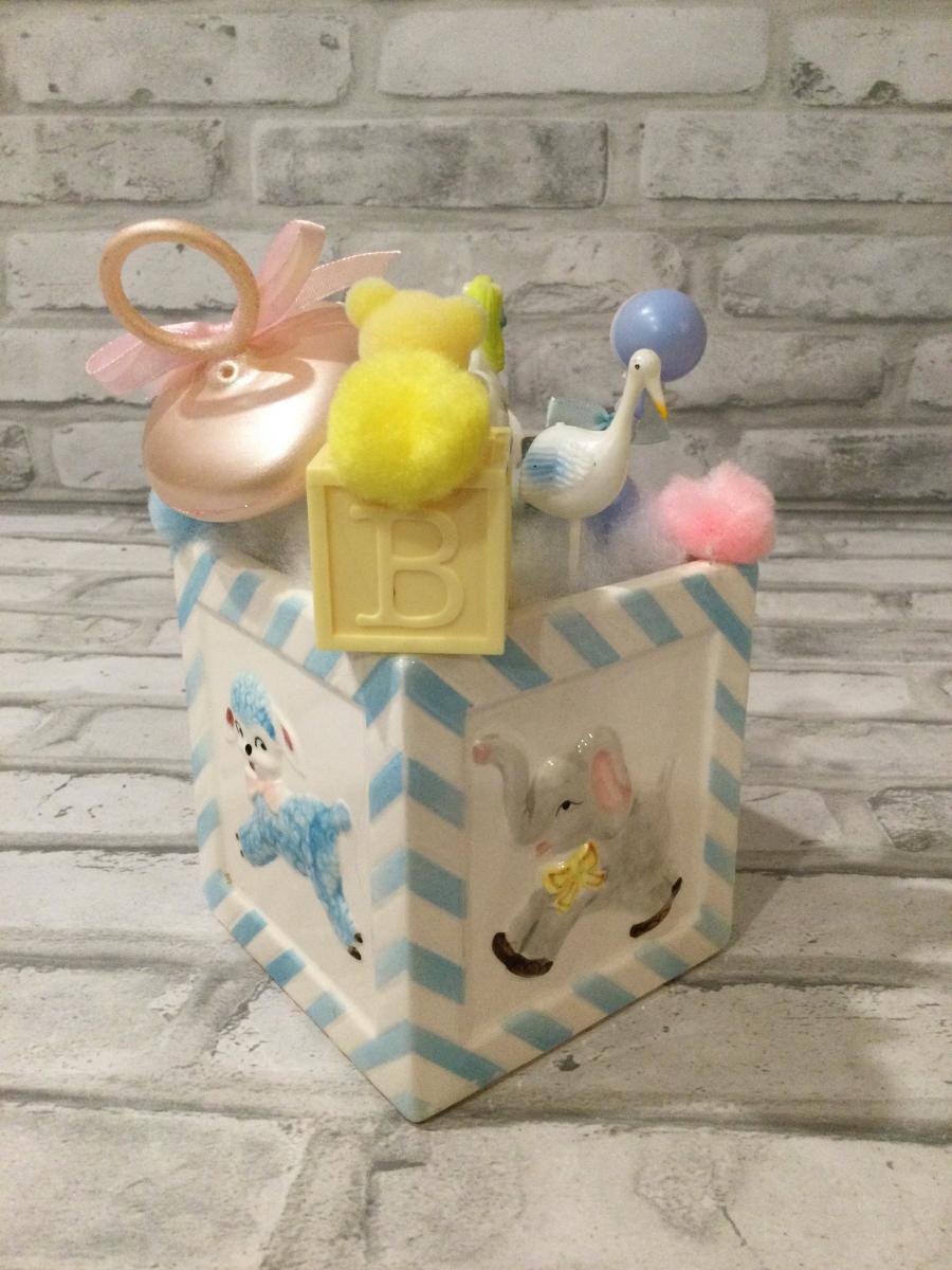 Antique Napcoware baby planter filled with antique decorations picture