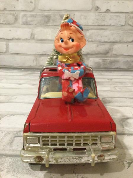 Red Nylint trail ranger truck with antique decorations picture