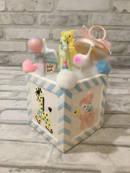 Antique Napcoware baby planter filled with antique decorations