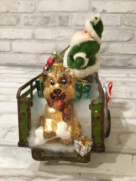 Antique green trailer filled with antique Christmas decorations and vintage ornaments picture