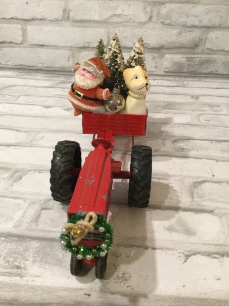 Red tractor and trailer filled with antique Christmas decorations and ornaments picture