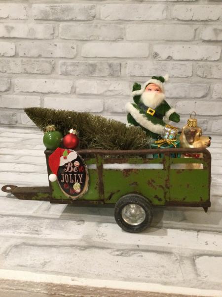 Antique green trailer filled with antique Christmas decorations and vintage ornaments picture