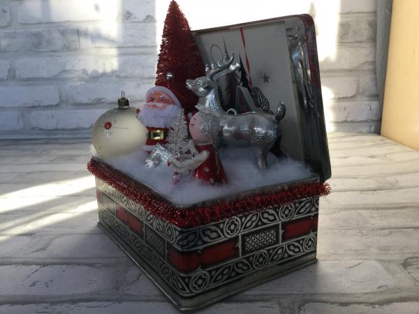 Antique Christmas tin filled with vintage Christmas decorations. picture
