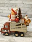 Vintage Tonka truck filled with antique Christmas decorations