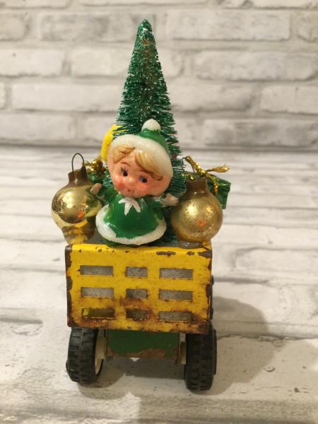 Antique Tonka green and yellow truck filled with antique Christmas ornaments and vintage decorations picture