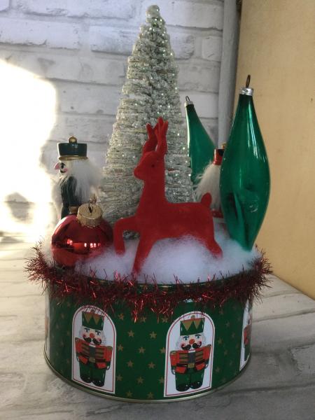 Christmas tin filled with vintage Christmas decorations. picture