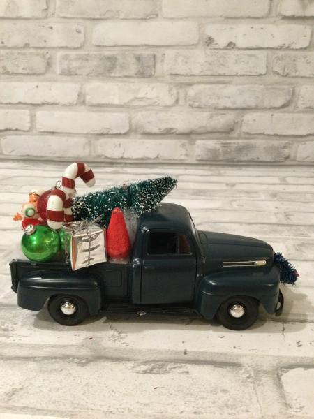 Dark green Ford truck with vintage decorations picture