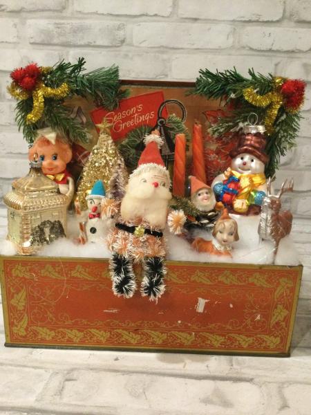 Antique Christmas tin filled with antique Christmas decorations