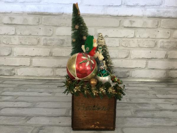Antique Borden’s cheese box filled with antique Christmas decorations picture