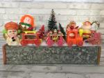Antique tool box drawer filled with antique Christmas decorations.