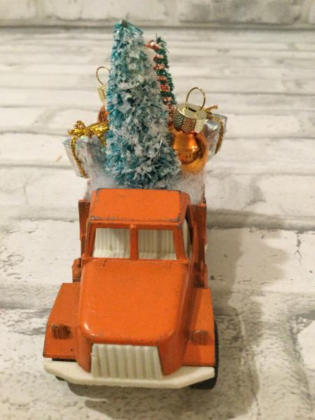 Vintage rust truck filled with vintage Christmas decorations picture