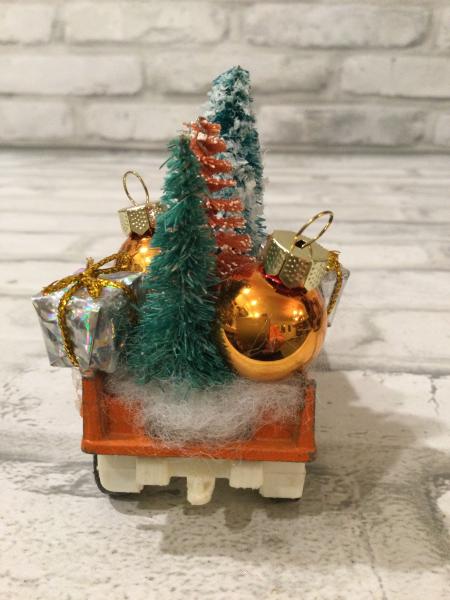 Vintage rust truck filled with vintage Christmas decorations picture