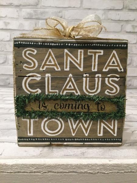 Wood sign with Santa Claus is coming to town. picture