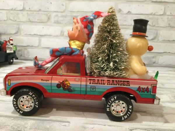 Red Nylint trail ranger truck with antique decorations