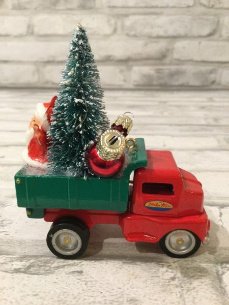 Vintage red and green dump truck  filled with vintage Christmas decorations picture