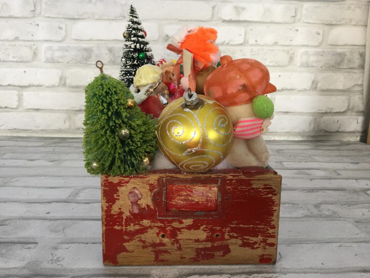 Antique tool box drawer filled with antique Christmas decorations. picture