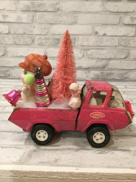 Vintage pink Tonga truck filled with antique Christmas decorations picture