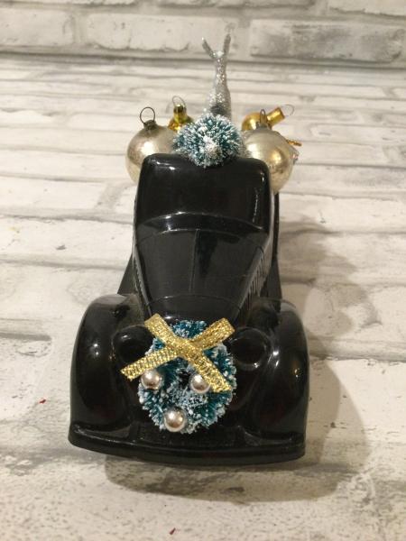 Vintage black truck filled with antique Christmas ornaments and vintage decorations picture