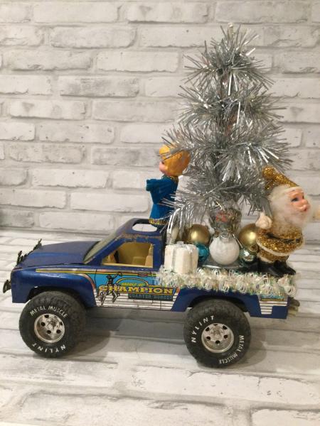 Vintage Nylint metal muscle truck in blue filled with vintage Christmas decorations