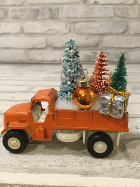 Vintage rust truck filled with vintage Christmas decorations picture