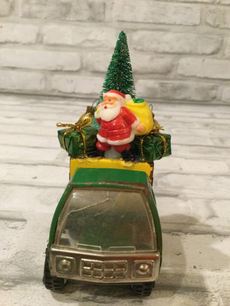 Antique Tonka green and yellow truck filled with antique Christmas ornaments and vintage decorations picture