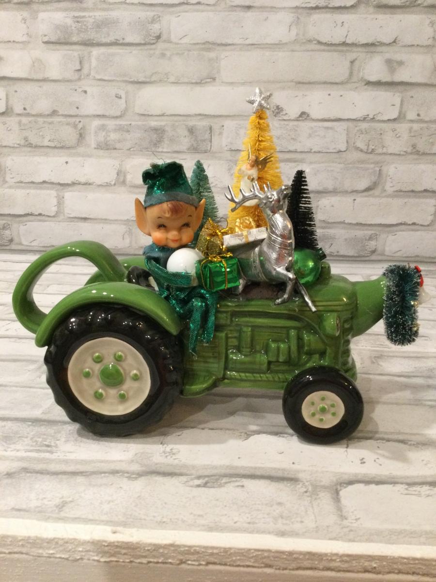 Green tractor with antique decorations and ornaments picture