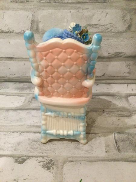 Antique baby high chair filled with antique and vintage decorations picture