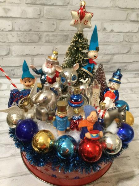 Antique red tin filled with antique Christmas decorations and ornaments picture