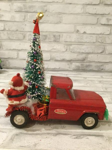 Antique red Tonka truck with antique decorations picture