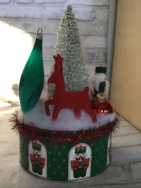 Christmas tin filled with vintage Christmas decorations. picture