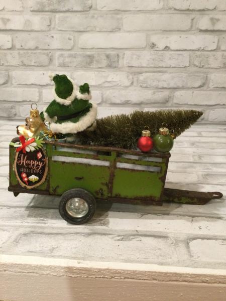 Antique green trailer filled with antique Christmas decorations and vintage ornaments picture