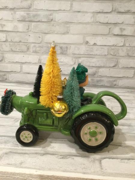 Green tractor with antique decorations and ornaments picture