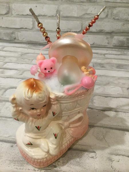 Rubens baby girl with sock filled with antique decorations picture