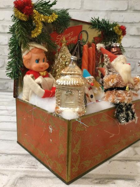 Antique Christmas tin filled with antique Christmas decorations picture