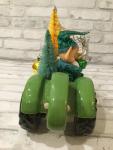 Green tractor with antique decorations and ornaments