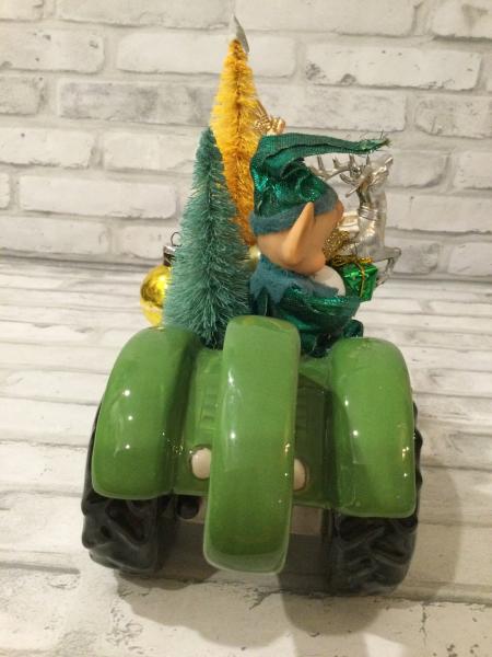 Green tractor with antique decorations and ornaments picture