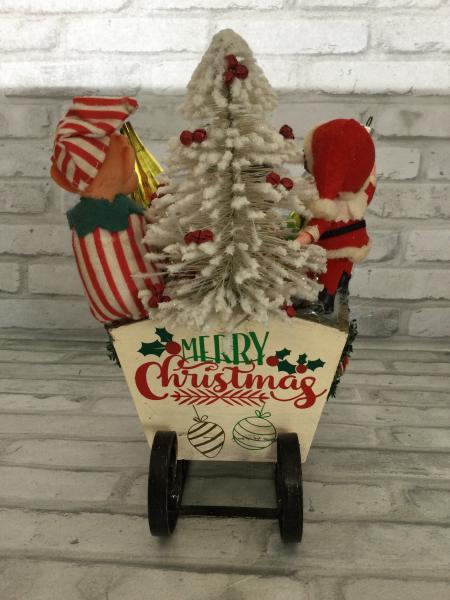 Sleigh filled with antique Christmas decorations. picture