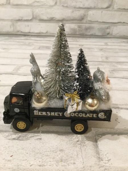 Vintage Hershey truck filled with antique Christmas ornaments and vintage decorations picture