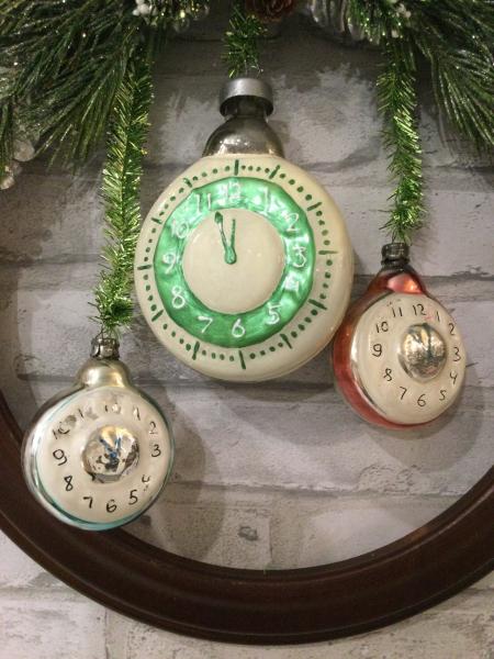 Wood circle wall hanging with Czechoslovakian clock ornaments. picture