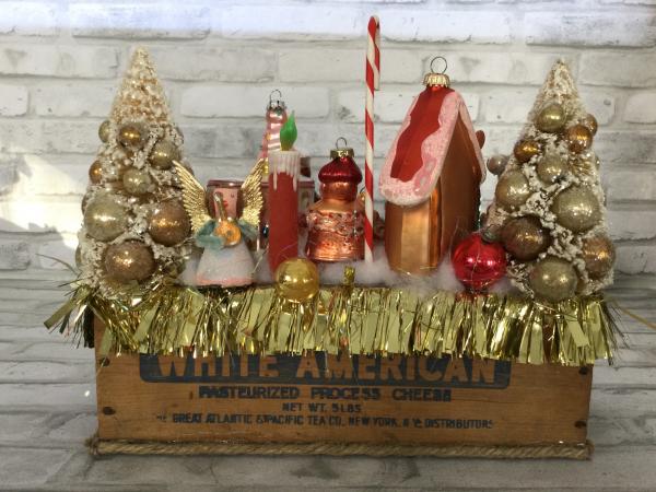 Antique cheese box filled with antique Christmas decorations picture