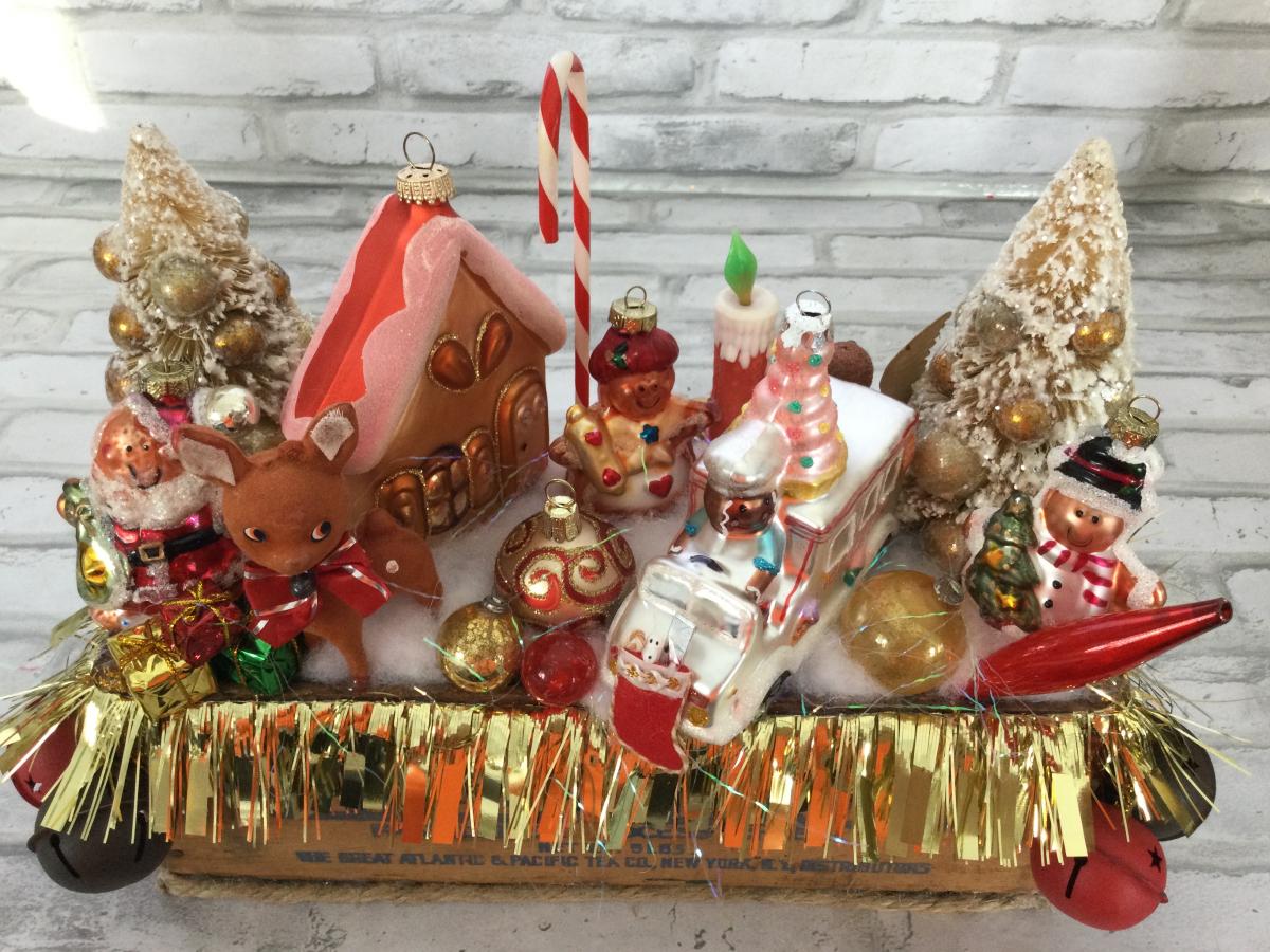Antique cheese box filled with antique Christmas decorations picture
