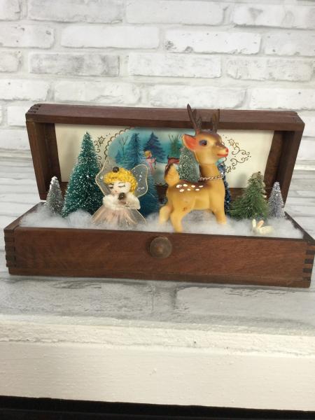 Antique wood box filled with antiques. picture