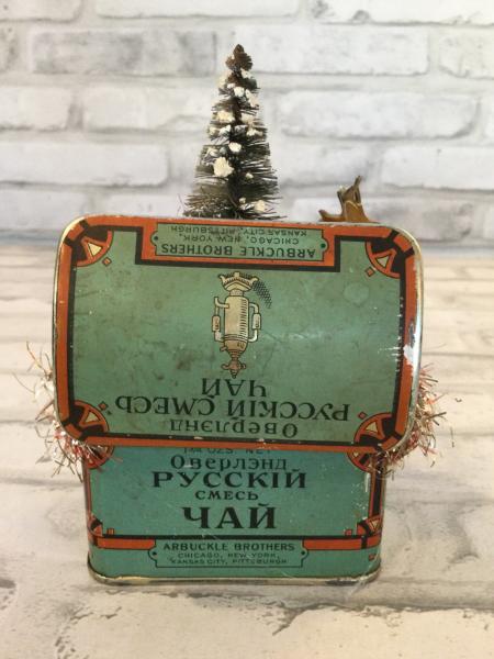 Antique tin filled with vintage Christmas decorations picture