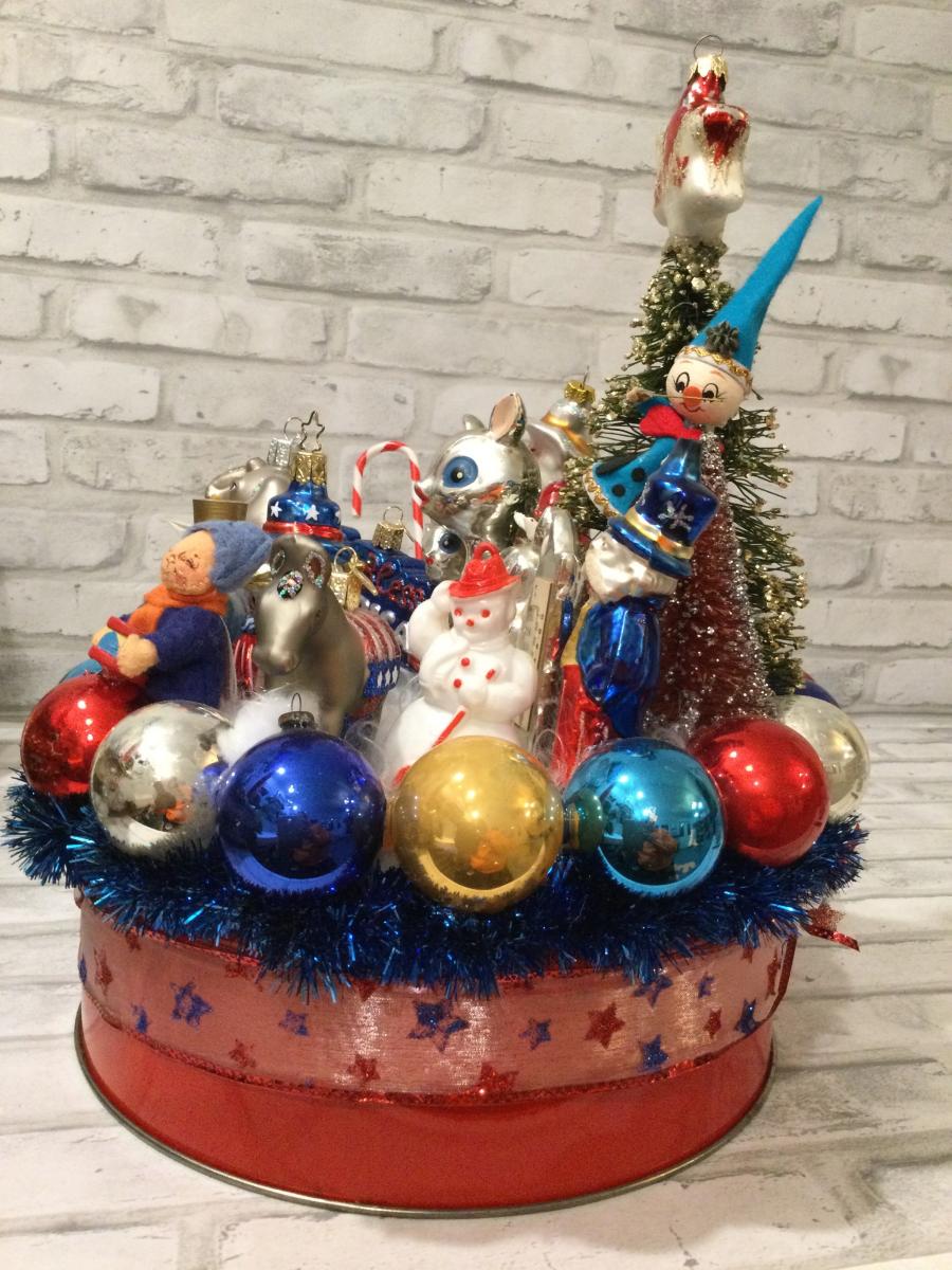 Antique red tin filled with antique Christmas decorations and ornaments picture