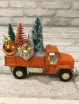 Vintage rust truck filled with vintage Christmas decorations