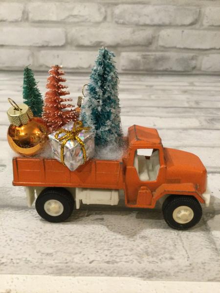 Vintage rust truck filled with vintage Christmas decorations picture