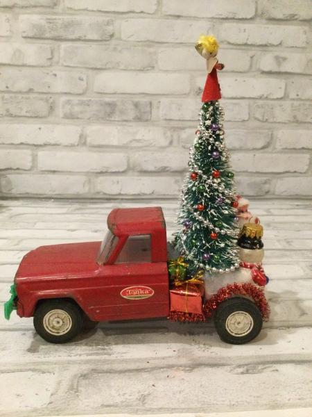 Antique red Tonka truck with antique decorations picture