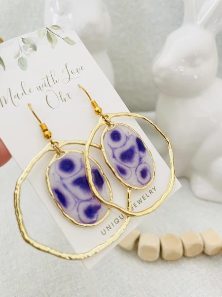 White and purple resin earrings picture